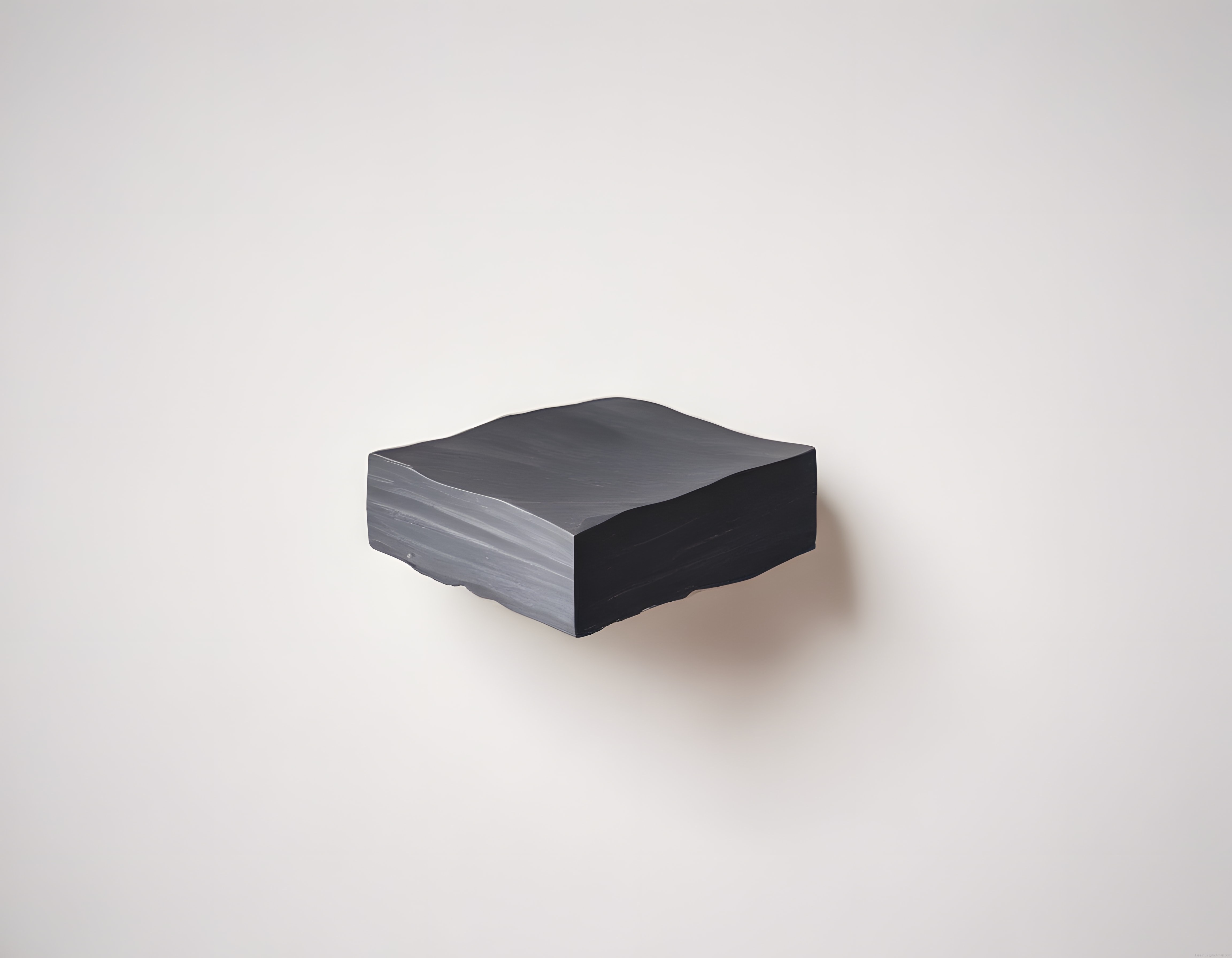 minimalist duvar heykeli koyu gri doğal taş formunda sanat objesi